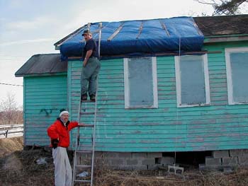 005 -Securing the North side of roof in March 2003