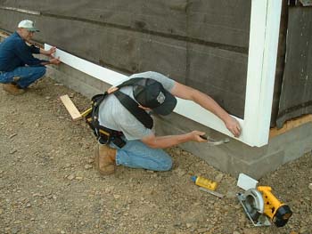 040 -  First clapboard being applied