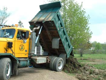 044 - County delivering ditch dirt